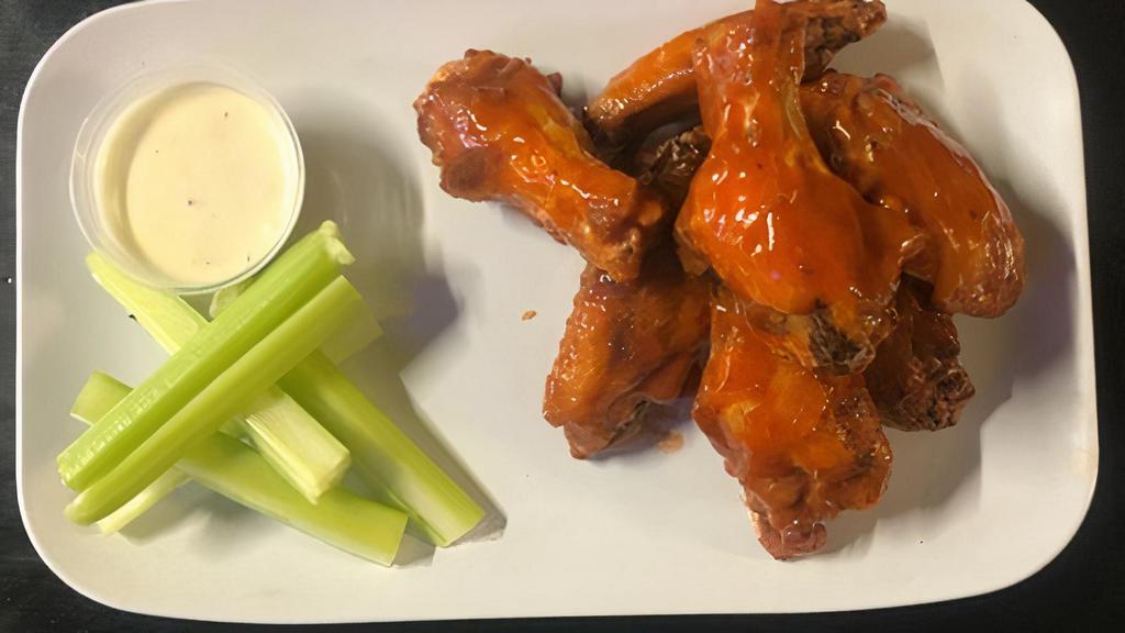 Chicken Wings (8) · Cajun dry rub or tossed in buffalo sauce or BBQ sauce, served with blue cheese & celery.