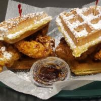 Chicken And Waffle Sliders · 4 Chicken Tenders Served on a Belgian Waffle with Powdered Sugar and Syrup