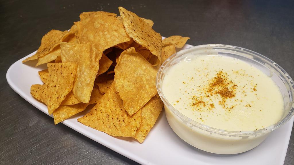 Queso Dip · White cheese dip served with tortilla chips.