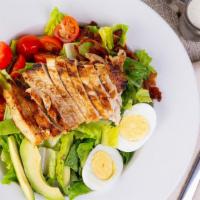 Nellie'S Cobb Salad · Chopped romaine lettuce, grilled chicken, cherry tomatoes, diced bacon, sliced avocado, blue...