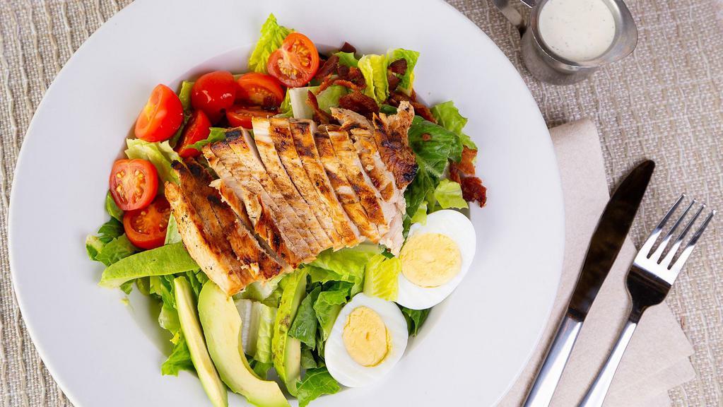 Nellie'S Cobb Salad · Chopped romaine lettuce, grilled chicken, cherry tomatoes, diced bacon, sliced avocado, blue cheese, and boiled egg.
