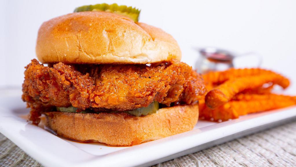 Nashville Hot Chicken Sandwich · Fried chicken breast with a spicy glaze and pickle.