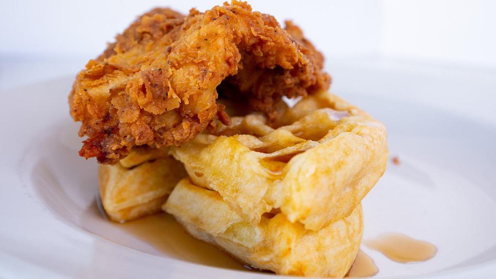 Chicken 'N' Waffles · Buttermilk battered chicken, crispy waffle, cinnamon honey butter, and maple syrup.