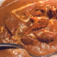 Chicken Makhni · Boneless chicken roasted in clay oven and folded into creamy tomato sauce.