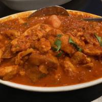 Chicken Vindaloo · Chicken cooked with vinegar, spices and potatoes in a spicy gravy.