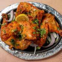 Tandoori Chicken · Marinated chicken roasted in clay oven.