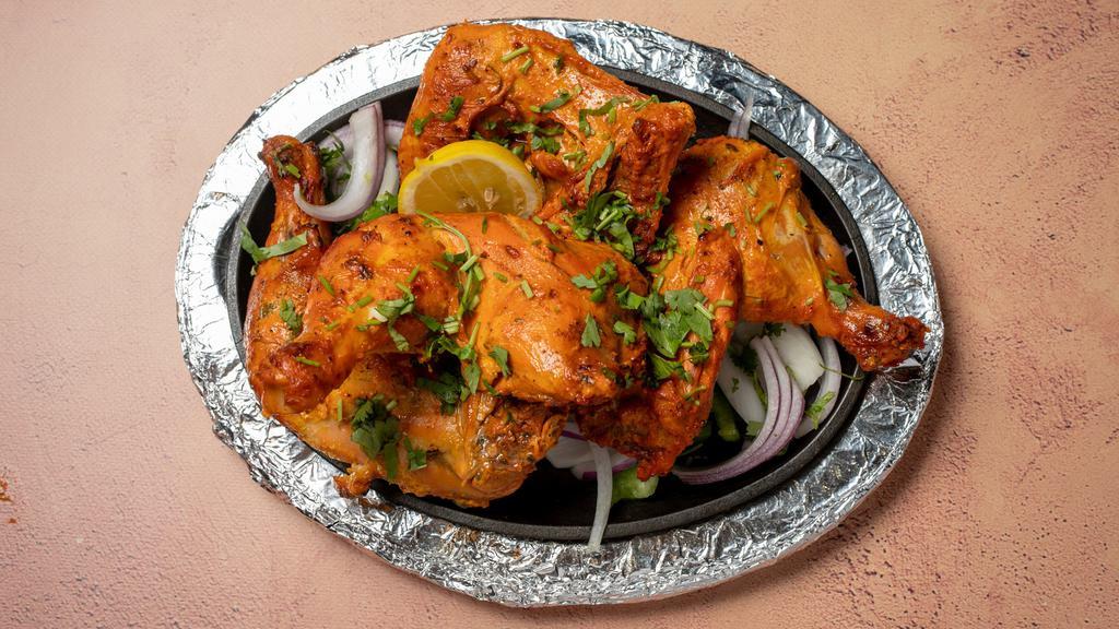 Tandoori Chicken · Marinated chicken roasted in clay oven.