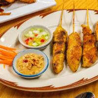Satay(4) · Three pieces. Grilled chicken marinated in coconut milk and curry spices. Served with peanut...
