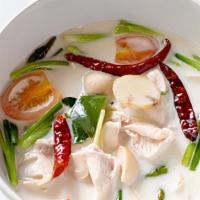 Tom Kha · Coconut milk soup with lemongrass, kaffir lime leaf, galangal, mushroom, and bowl of rice.