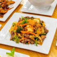 Pad Kee Maow · Drunken noodles. Stir fried flat rice noodles with Thai sauce, onions, hot pepper, bell pepp...