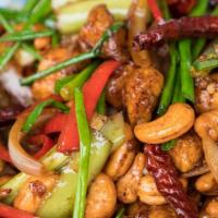 Golden Cashew Nut · Snow peas, broccoli, onion, green bean, and cashews in a sweet zesty sauce. Served with rice.