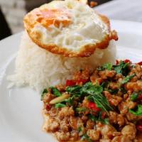 Pad Kha Pow · Sauteed meat with Thai sauce, bell pepper, onion, carrot, snow peas, and basil. Served with ...