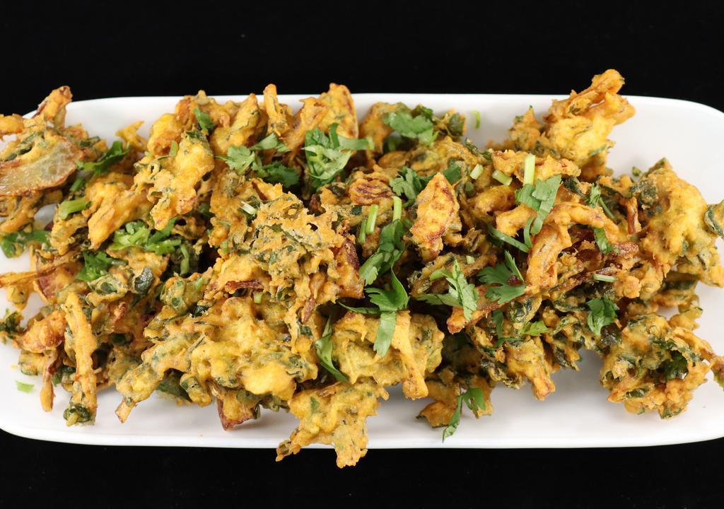 Pakodas · Crispy fried onions or spinach dipped in a chickpea and rice flour batter. Just like amma used to make.