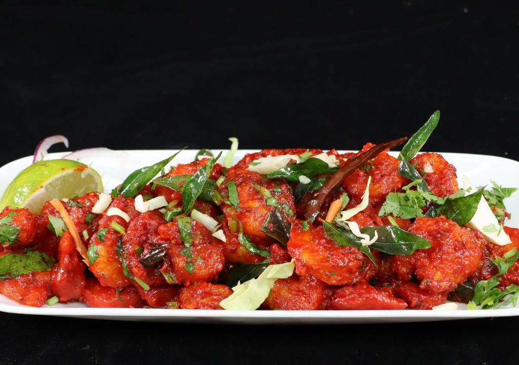 Jhinga (Shrimp) Apollo · Shrimp marinated in a medley of masala and deep-fried. The one that will take you to the moon and back.