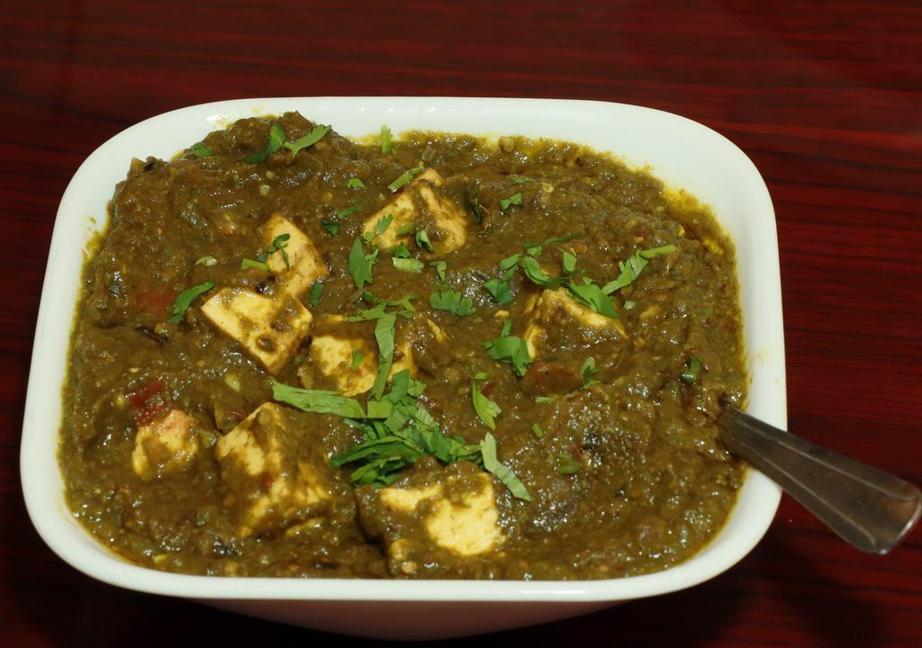 Paneer Saag · Paneer (cottage cheese)  cooked in a leafy based sauce, saag (spinach) with a touch of cream and spices.