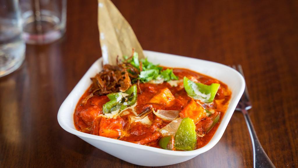 Paneer (Cottage Cheese) Tikka Masala · A spicy twist to the butter masala, but with onions, bell peppers, and our tikka masala.