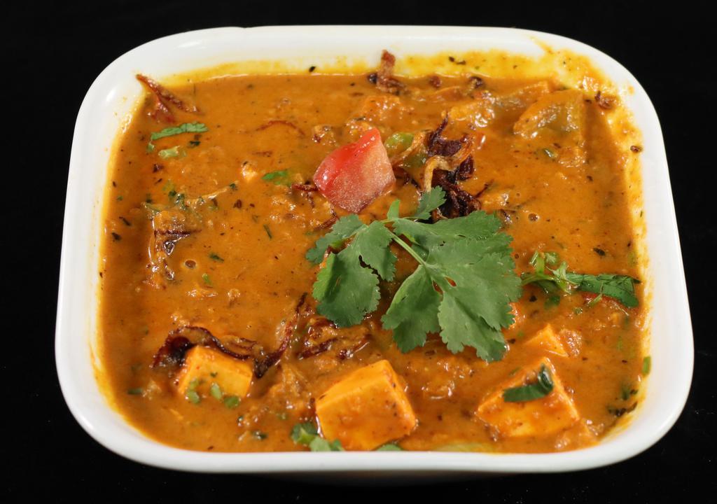 Kadai Paneer · Paneer (cottage cheese) cooked with bell peppers, tomatoes, and onion gravy.
