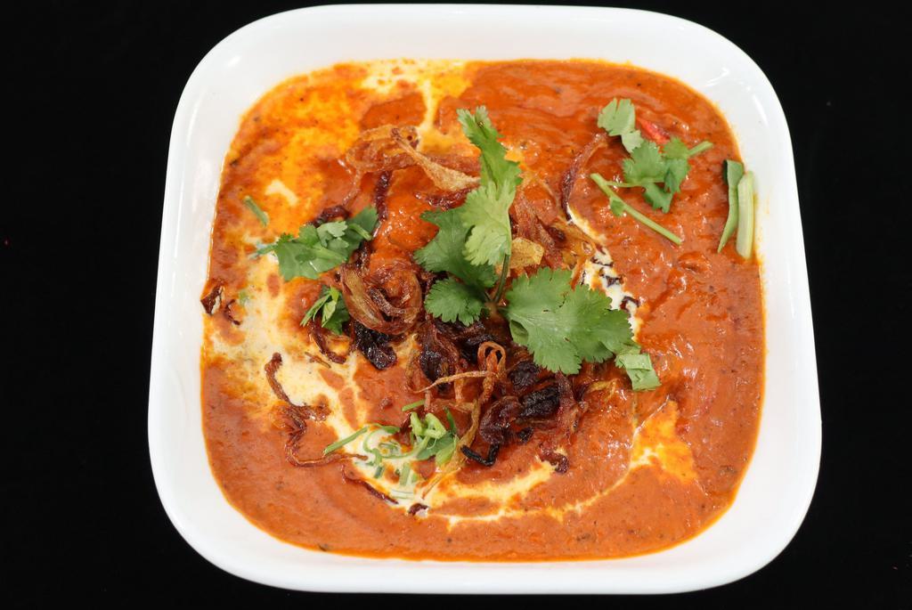 Chicken Tikka Masala · Tandoor roasted boneless chicken pieces cooked in a rich creamy sauce.