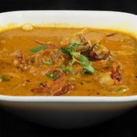 Goat Kadai · Goat cooked in a tomato and onion gravy base. This dish only requires one kadai (utensil) to...