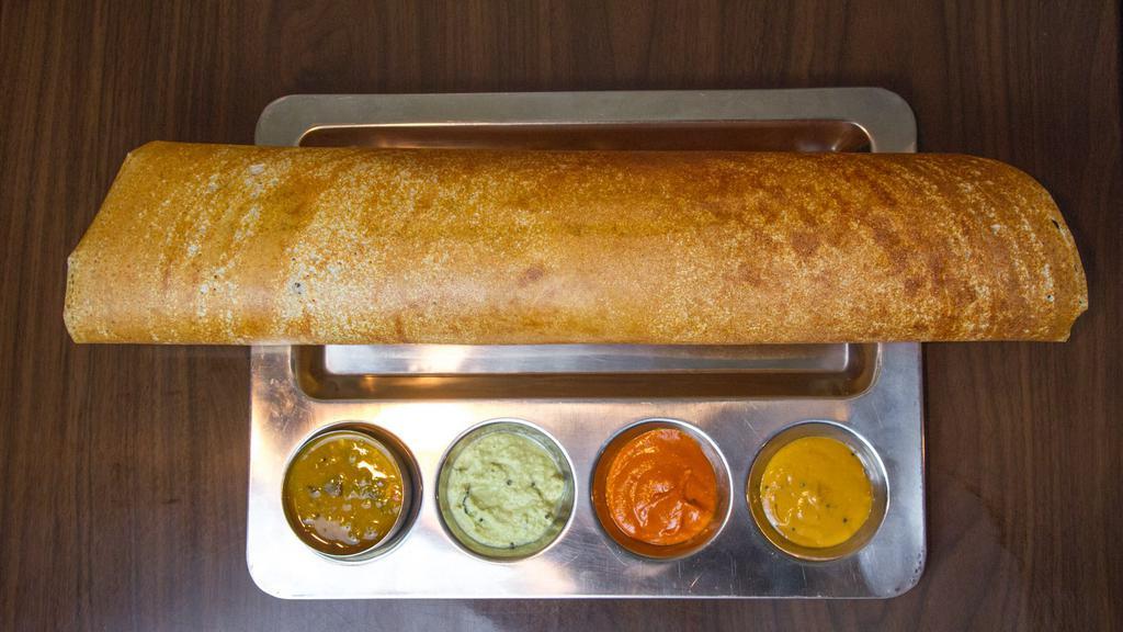 Plain Dosa · Crepe made with lentil and rice flour, served with chutney and lentil soup.