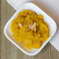 Pineapple Kesari · Sooji (sweet cream of wheat), cooked with pineapple chunks and topped with nuts.