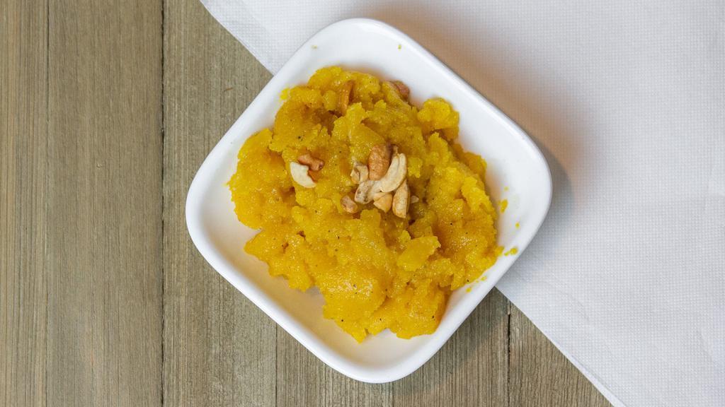 Pineapple Kesari · Sooji (sweet cream of wheat), cooked with pineapple chunks and topped with nuts.