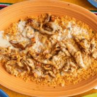 Arroz Con Pollo · Grilled chicken breast on a bed of rice and nacho cheese.
