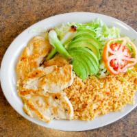 Pollo Loco · Seasoned grilled chicken breast served with rice, salad, and tortillas.
