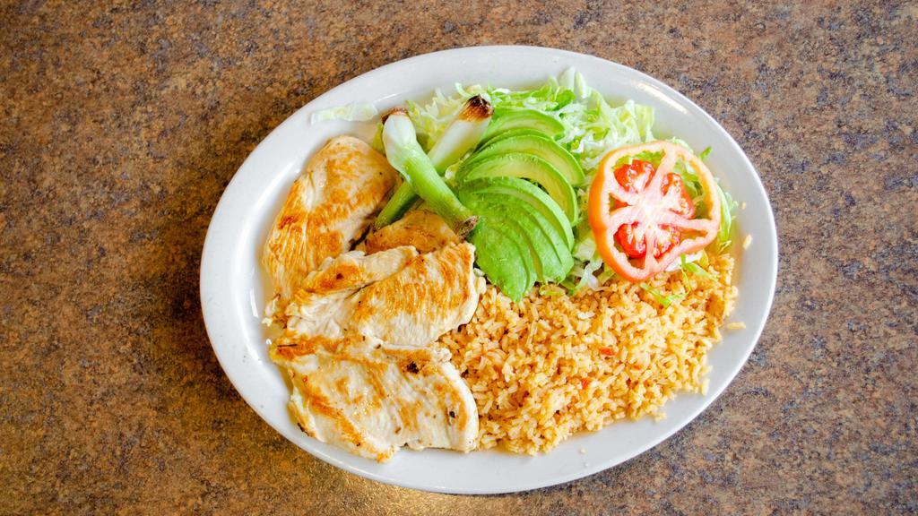 Pollo Loco · Seasoned grilled chicken breast served with rice, salad, and tortillas.