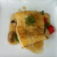 Ginger Sea Bass · An 8-oz fillet of Chilean sea bass served atop sautéed snow peas, asparagus, mushrooms and r...