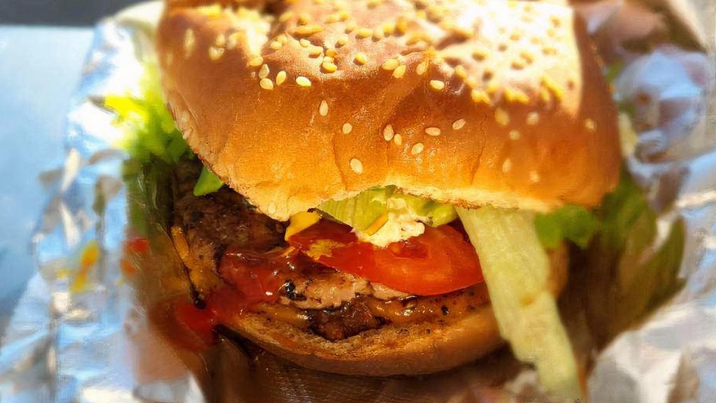 Turkey Burger · Handmade seasoned turkey burger with lettuce, tomato, onion, pickles, cheese and Vibe Sauce
