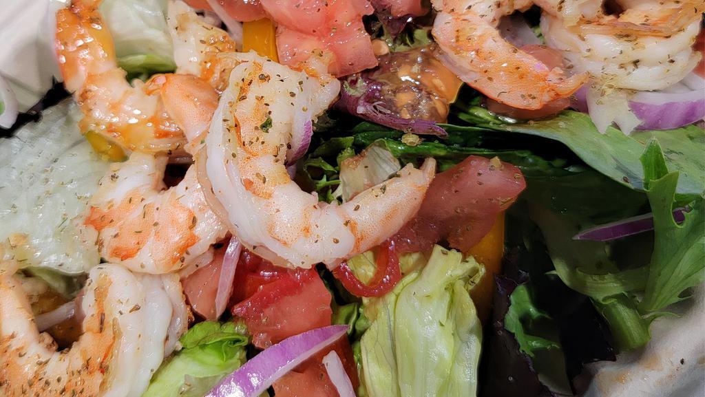 Grilled Shrimp Salad · Grilled shrimp on top of salad  Made of mixed greens and iceberg lettuce. Topped with onions, tomatoes, assorted bell peppers, cheddar jack cheese and pickle.