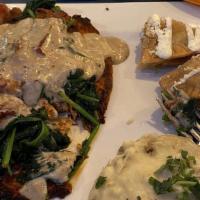 Chicken And Spinach · Highly recommended. Grilled chicken breast topped with creamy spinach and bacon sauce. Serve...