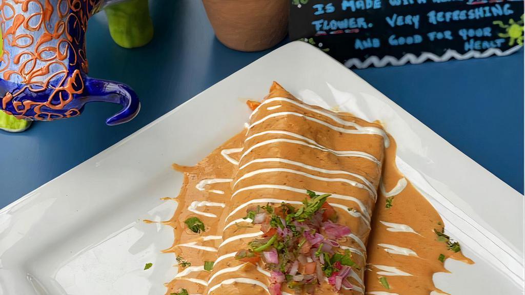 Burrito Chipotle (12In) · A big flour tortilla wrapped and filled with grilled chicken, beans, rice and grilled onions, covered with our delicious homemade chipotle sauce, pico de gallo and sour cream. Add steak for an extra charge.