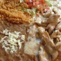 Pollo Con Crema. · Tender chicken strips cooked with green peppers and onions in authentic Mexican sour cream s...