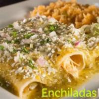 Enchiladas Verdes · Three enchiladas filled with ground beef or shredded chicken, topped with green salsa, and c...