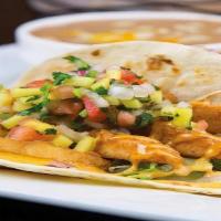Baja Fish Tacos · Two soft tacos filled with crispy beer-battered Tilapia. Topped with cabbage, pico de gallo ...