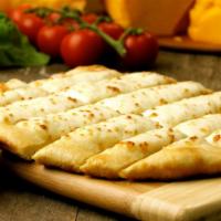 Cheesesticks · Our house crafted dough brushed with garlic butter & smothered with 100% mozzarella  cheese.
