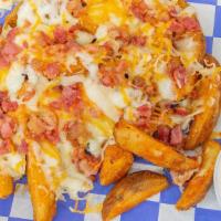 Bacon Cheese Fries · Seasoned fries topped with mozzarella, cheddar cheese & bacon. Served with ranch dressing.