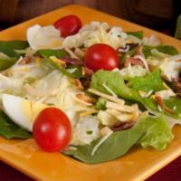 House Salad · Iceberg, romaine & spinach, topped with potato sticks, cheddar cheese, grape tomatoes, bacon...
