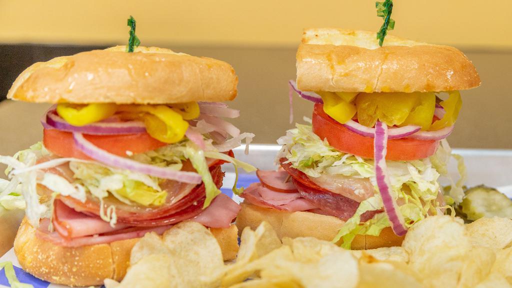 Italian Sub · Fresh slices of ham, salami & pepperoni with melted provolone, lettuce, tomato, red onion & banana peppers. Served with a side of Balsamic Vinaigrette dressing.