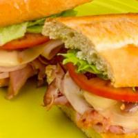 Turkey Club · Sliced ham & turkey, bacon, melted provolone, topped with lettuce & tomato. Served with hone...