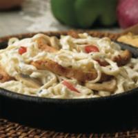 Chicken Alfredo Pasta · Linguini baked in rich alfredo sauce with fresh mushrooms, tomatoes & grilled chicken.