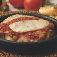 Lasagna · Layers of pasta with ground beef,  special cheese blend & pasta sauce.