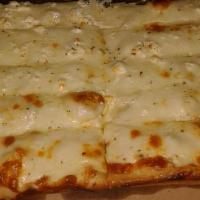 Feta Cheese Bread · Crumbled feta covering a 3 cheese blend, comes with 1 marinara