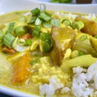 Chicken Curry Rice Bowl · Gluten free item. Mild curry paste cooked with coconut milk, onion, lemongrass, carrots, pot...