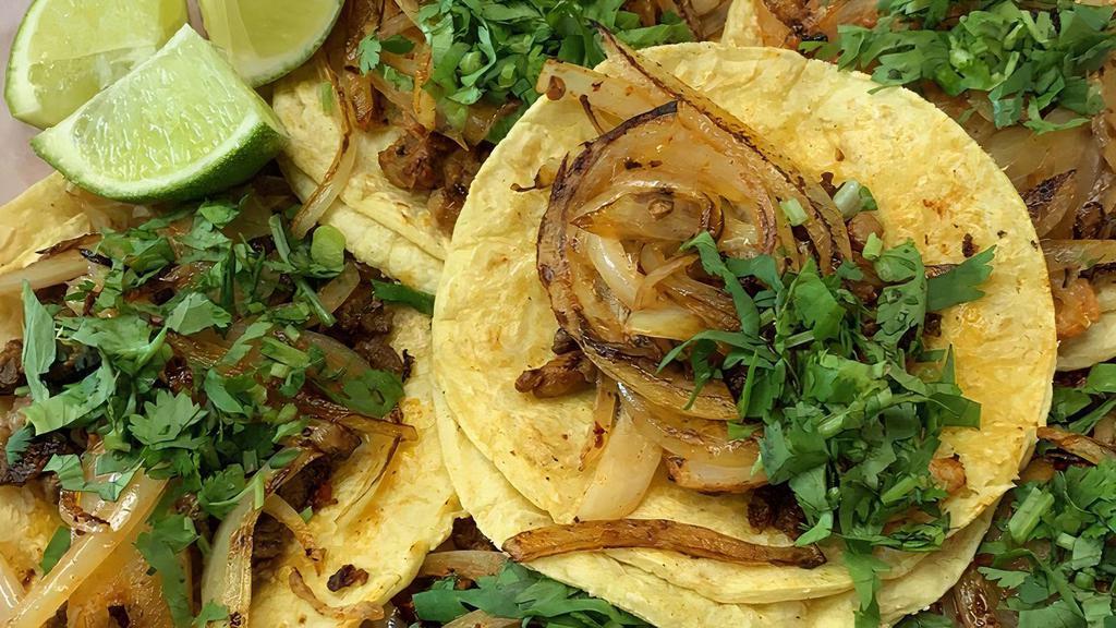 Tacos · Corn tortilla filled with your choice of meat, chopped onion and cilantro.