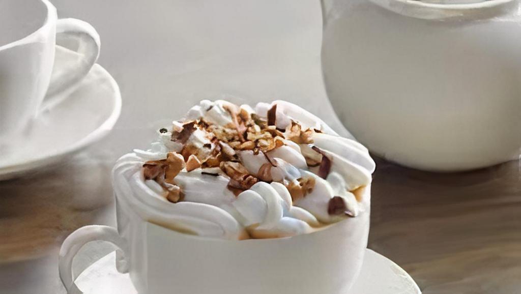 Heath Hot Chocolate · This thick hot chocolate is infused with chocolate syrup, steamed milk and topped with a nice thick dollop of whipped cream, caramel and chocolate syrup drizzle and crushed heath pieces.