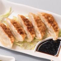 Gyoza Dumpling · Six pieces stuffed vegetable and pork Japanese dumpling pan-fried or steamed and served with...