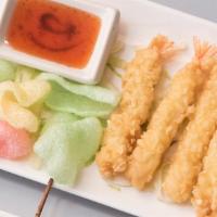 Shrimp Tempura Roll · Crispy tempura shrimp, avocado, cucumber, smelt roe, and sesame seeds.